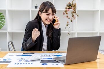 Beautiful business woman talking on mobile phone and showing happy expression, emotional business woman portrait. Concept of young business women, business women leaders, business management by women.