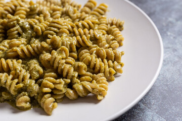 Pasta with pesto. Typical Italian dish with basil sauce