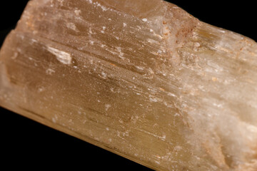 Macro mineral stone Spodumene on a black background
