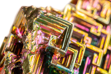 Macro of the mineral bismuth stone on a white background