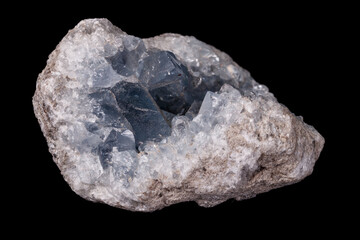 Celestine mineral stone macro on microcline on black background