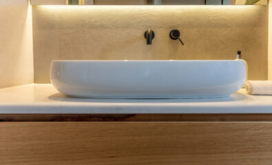 Bathroom sink basin and faucet modern interior design. Black taps and white washbasin,