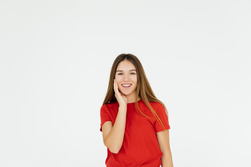 Fototapeta premium Portrait of a pretty smiling woman posing on a white background