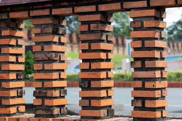 Old fence posts made of brown bricks. old city wall in Nakhon Si Thammarat