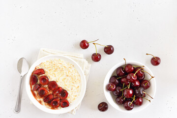 Oatmeal porridge with cherry slices