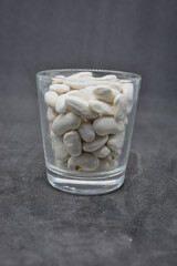 Grains of white beans in dried form .