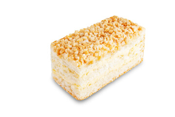 Sponge cake with cream and nuts on a white isolated background
