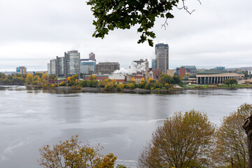 Fototapeta na wymiar Panoramic view of Ottawa River and Gatineau city of Quebec in Canada from Major's Hill Park in autumn