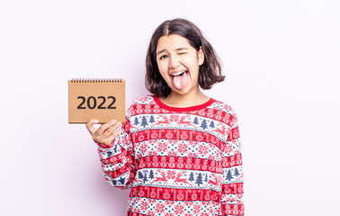 pretty young woman with cheerful and rebellious attitude, joking and sticking tongue out. 2022...