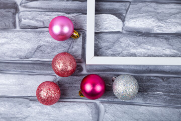 Frame and Christmas decor on a gray background. Christmas card.