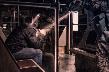 Image of a SWAT team arresting a criminal in the subway. Special operation concept.