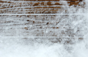 Winter snow background with old planks