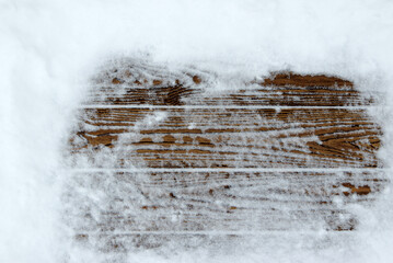 Obraz na płótnie Canvas Winter snow background with old planks