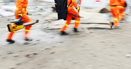 Search and rescue forces search through a destroyed building. blur motion.