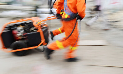 Search and rescue forces search through a destroyed building. blur motion.