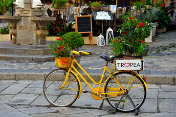 Fototapeta na wymiar bicycle in the historic center as street furniture Tropea Italy