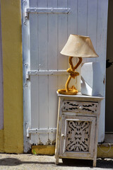 bedside table lamp in a corner of the historic center of tropea italy - obrazy, fototapety, plakaty