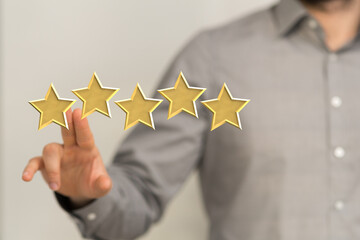 pointing five star symbol to increase rating of company