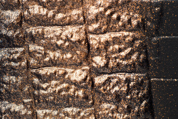 Bronze stone texture. Dark background for design.