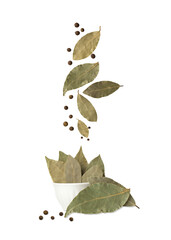 Bay leaf with allspice isolated on white background. Falling spices. Flying seasoning.