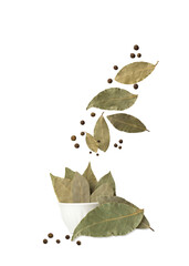 Bay leaf with allspice isolated on white background. Falling spices. Flying seasoning.