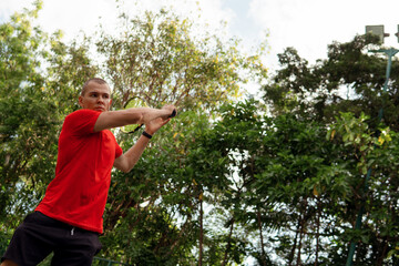 man in red sportwear playing tennis