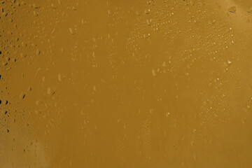 Yellow backgrond with water drops.