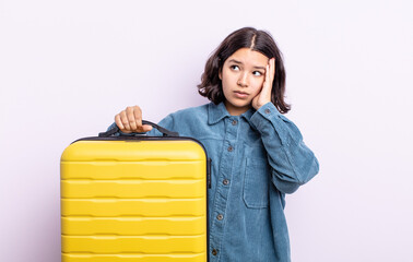 pretty young woman feeling bored, frustrated and sleepy after a tiresome. travel case concept