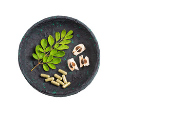 Obraz na płótnie Canvas Moringa leaves, seeds and capsules - Moringa oleifera