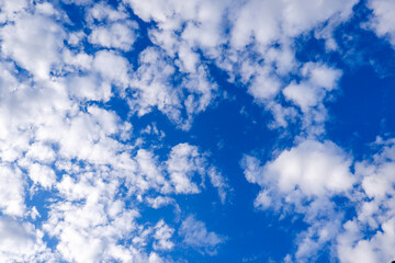 Bright blue sky. There are gray and white clouds in the sky.