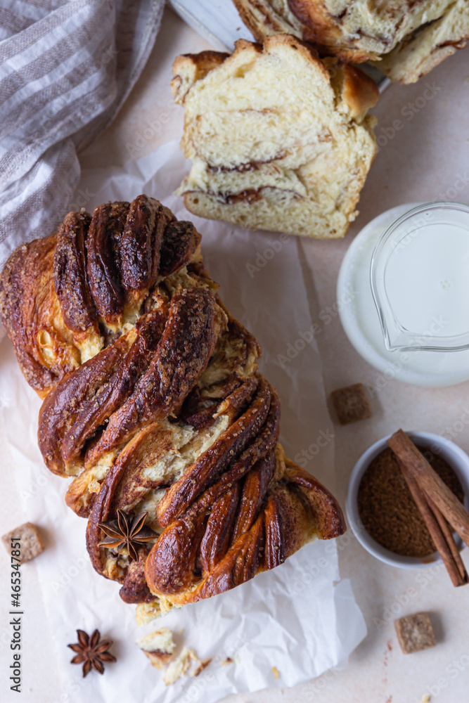 Wall mural Cinnamon and brown sugar babka or brioche bread with jam and milk. Homemade pastry for breakfast. Top view.