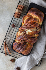 Cinnamon babka or swirl brioche bread. Cinnamon roll bread. Povitica: traditional Polish sweet bread. Homemade pastry for breakfast. Top view.