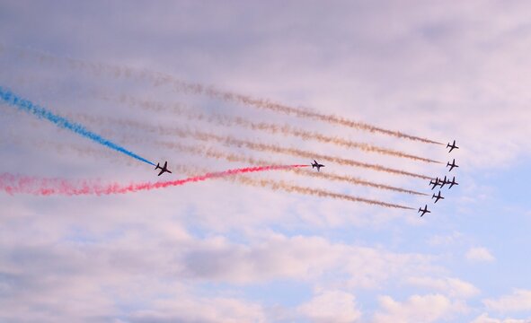 Red Arrows Aerobatic Display Team With Red White And Blue Vapor Trails