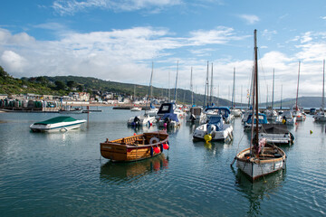 Boats in the harbour at Lyme Regis in Dorset, UK.