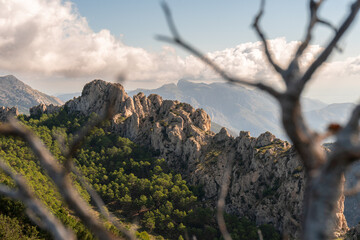 Landscape with steep mountains on a day with sun and clouds, in Serrella mountain, Alicante (Spain)