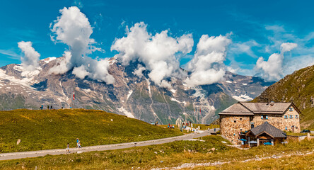 Beautiful alpine summer view with the Wiesbachhorn in clouds at the famous Großglockner high...