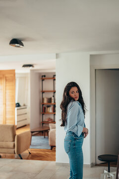 Attractive Young Businesswoman Getting Dressed For Work At Home