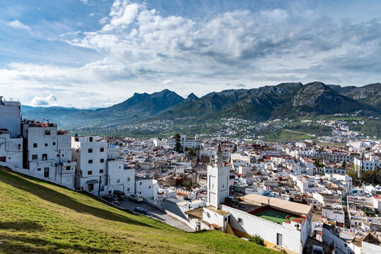 The medina of Tetouan in Morocco. A view of the medina from the top of the hill, with a mosque in the foreground.