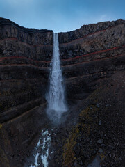 Aerial drone detailed view of Hengifoss waterfall basaltic layers, Iceland