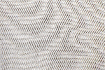 Real grey knitted fabric made of heathered yarn textured background