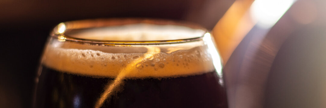 glass of dark porter craft beer panorama