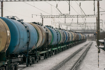 Fototapeta na wymiar Transportation of liquid bulk cargoes by rail in winter. In perspective. Logistic concept.
