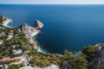 Aerial view of beautiful landscape of Simeiz village from cat mountain. Diva and Penea rocks in background. Crimea