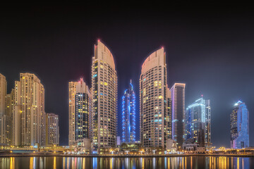 Fototapeta na wymiar Night time panoramic view of Dubai Marina bay and city center, UAE