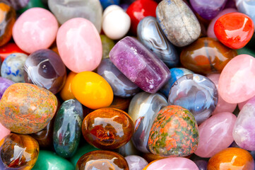 А pile of semi-precious, precious stones, close-up. The best natural material for interior design,...