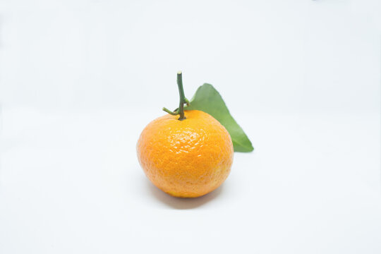 Close-up Of Orange Fruit Against White Background