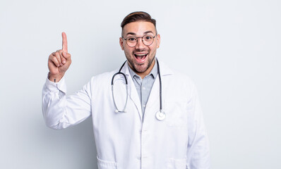 young handsome man feeling like a happy and excited genius after realizing an idea. physician...