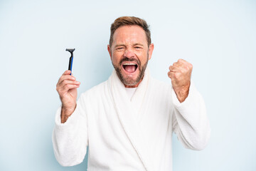middle age man shouting aggressively with an angry expression. shave concept
