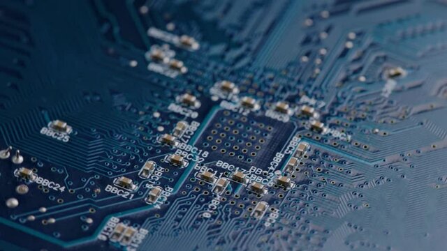 Computer electronic circuit board with radial conductor tracks and SMD capacitors rotating macro