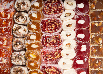 Turkish delight background. a bunch of assorted Turkish delicacies with and without nuts